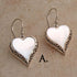 Heart shaped silver mother of pearl pendant on silver labradorite necklace